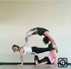 two women are doing yoga on the floor