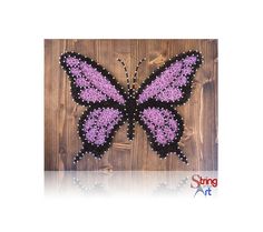 a purple and black butterfly is on a wooden background with the words string art written below it