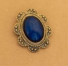 Vintage Royal Oval Art Deco Abyss Blue Brooch Notes:  Some scratching to the center  Features:  Brand: NA Color: Gold Tone, Blue Material: NA Size: Last image shows item with a ruler Blue Oval Brooch For Gifts, Blue Oval Brooch, Blue Brooch, Ruler, Brooch Pin, Brooches, Gold Tones, Art Deco, Etsy Uk