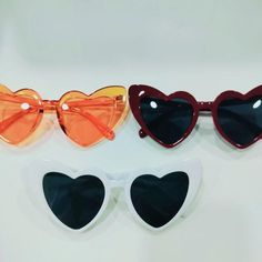 Elevate your style with these trendy Heart Shaped Sunglasses, perfect for adding a touch of fun and flair to any outfit. Available in vibrant red, orange, and white, these retro love sunglasses are a must-have accessory for any fashion-forward individual. Whether you're gearing up for a summer party, planning a festival outfit, or looking for the perfect bridesmaid gift, these sunglasses are the ideal choice. 😎❤️ 💖 Unique Design: These sunglasses feature a playful heart-shaped frame, making th Cheap Orange Sunglasses For Vacation, Cheap Orange Sunglasses For Parties, Cheap Orange Sunglasses For Party, Personalised Bridesmaid Gifts, Party Souvenirs, Retro Love, Frame Making, Heart Shaped Frame, Party Sunglasses