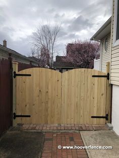 a wooden gate with two black bars on it