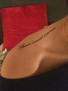 the back of a woman's neck with an inscription on it that reads, never trust someone