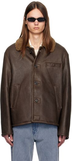 Waxed and grained lambskin jacket. · Shearling spread collar · Button closure · Welt pockets · Central vent at back hem · Shearling interior Supplier color: Rustic grain brown shearling Classic Brown Fur Coat For Work, Brown Shearling Fur Coat With Pockets, Brown Shearling Outerwear For Work, Brown Leather Fur Coat For Workwear, Brown Sheepskin Outerwear For Work, Brown Shearling Outerwear With Padded Collar, Brown Shearling Fur Coat For Work, Brown Sheepskin Fur Coat With Padded Collar, Brown Shearling Fur Coat With Padded Collar