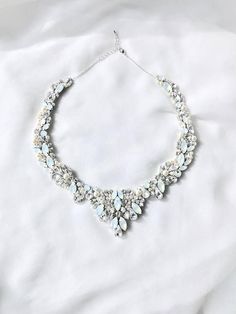 *Photo Credit: www.madlyphoto.com & Instagram: @madly_photo If you are searching for a statement bridal necklace that will make you feel like royalty, then this incredibly detailed Swarovski Rhinestone collar necklace is surely the one! Each stone is hand placed onto the design for a truly one of a kind, handmade statement bridal necklace. The details in this piece are nothing short of amazing. Totaling 6 hours of design time, this piece of art is exquisite and will complete your bridal look Bridal Bib, Belle Necklace, Boho Wedding Accessories, Necklace For Neckline, Wreath Necklace, Wedding Accessories For Bride, Gold Bridal Necklace, Gold Collar Necklace, Necklace Opal