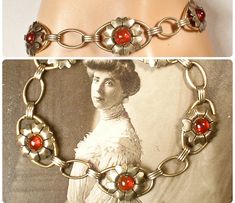 "I am SO thrilled to be offering a stunning Art Nouveau/Art Deco circa 1920s -1930s era 12 karat gold over sterling silver dark red glass cabochon flower link bracelet perfect for the Bride  The ornate flower shaped links feature deep red glass cabochon centers.  Note that it was tough to photo as the red is a true red/red with no hints of orange.   Bracelet measures 7 1/8 inches  (17.8 cm) around and is just under 5/8 inches at 9/16 inches (15 mm) wide.  This treasure is in excellent antique co Gold Art Nouveau Wedding Jewelry, Vintage Charm Bracelets For Wedding, Antique Wedding Bracelet With Vintage Charm, Vintage Metal Bracelets For Weddings, Vintage Wedding Bracelet Jewelry, Art Deco Gold Wedding Bracelets, Vintage Adjustable Jewelry For Wedding, Antique Red Wedding Jewelry, Gold Art Deco Wedding Bracelets