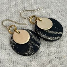 "Clay Earrings, Lightweight Dangle, Black and Gold Disc Earrings, Celestial Earrings, Neutral Earrings  1/2\" brass discs are accented by hand formed 7/8\" black polymer clay discs.  The black clay has a beautiful gold and silver celestial marbled pattern.  Each one is unique!   They hang from gold filled earwires. They measure about 1.5\" from the top of the ear wire to the bottom of the disc." Black Dangle Plug Earrings For Gift, Black Dangle Plug Earrings As Gift, Black Drop Plug Earrings, Black Dangle Earrings With Ear Wire, Black Drop Earrings With Ear Wire, Black Dangle Earrings For Everyday, Black Drop Earrings For Everyday, Black Single Dangle Earring, Black Single Drop Earring