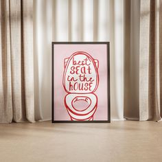 a pink poster with the words beat seat in the house on it next to a window