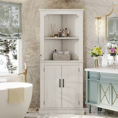 a bath room with a tub and a shelf next to a window filled with flowers