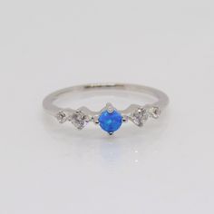 Vintage Sterling Silver Blue Opal & White Topaz Band Ring....Marked 925...Total of weights 1.3grams... Size 7...Measure of Face 4MM...It's in very good condition. Blue Opal Birthstone Ring In Sterling Silver, Blue Cubic Zirconia Birthstone Ring, Blue Sterling Silver Opal Promise Ring, Blue Opal Ring Birthstone Fine Jewelry, Blue Opal Birthstone Ring Fine Jewelry, Blue Diamond Ring With Vs Clarity In Sterling Silver, Sterling Silver Crystal Ring With Blue Birthstone, Blue Crystal Birthstone Ring In Sterling Silver, Hallmarked Sapphire Birthstone Promise Ring