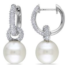 These marvelous earrings from the Miadora Signature Collection feature 9-9.5 mm South Sea round white pearls enhanced by a total of 128 round white diamonds. This classic pair is set in 14-karat white gold and are secured with clip-in backs. Style: Dangle Pearl type: South Sea Grade: AA Color: White Pearl size: 9-9.5 m Golden South Sea Pearls, Pearl And Diamond Earrings, Diamond Dangle Earrings, Link Earrings, Earrings Diamond, Circle Diamond, Sea Pearl, Pearl Hoop Earrings, Earrings Hoop