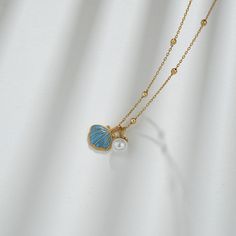 Description & Details Embrace the beauty of the sea with our meticulously crafted pieces that capture the essence of shells in stunning detail. From elegant shell-shaped pendants to intricate shell-inspired necklaces, our collection offers a range of styles to suit your unique taste. • Material: Solid 925 Sterling Silver ∙ Enamel• Finish: Hypoallergenic ∙ Gold Plating• Dimensions: 40 - 45 cm chain, adjustable• All our work is custom made by hand with love Elegant Shell-shaped Charm Necklaces For Beach, Elegant Ocean Color Jewelry For Gifts, Shell-shaped Pearl Charm Necklace, Elegant Shell-shaped Summer Jewelry, Elegant Summer Shell-shaped Jewelry, Shell-shaped Jewelry With Pearl Pendant, Shell-shaped Pearl Pendant Jewelry, Shell Necklace With Pearl Pendant, Shell-shaped Charm Necklaces Made Of Shell As Gift