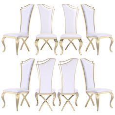 six chairs with white upholstered back and gold trimmings, all in different sizes