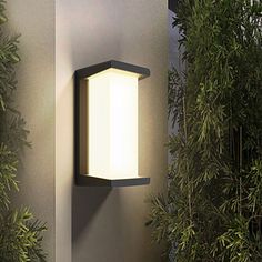 a modern outdoor wall light on the side of a building