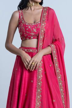 Pink raw silk floral embroidered lehenga with attached cancan. Paired with scoop neck padded blouse and dupatta.
Component: 3
Pattern: Embroidery
Type Of Work: Floral
Neckline: Scoop
Sleeve Type: Sleeveless
Fabric: Blouse and Lehenga: Raw Silk; Dupatta: Organza
Color: Pink
Other Details: 
Lehenga Length: 42 inches
Embroidered border dupatta
Tassel tie-up detailing
Note: The neckpiece worn by the model is not for sale
Occasion: Bride,Wedding - Aza Fashions Wedding Choli With Floral Embroidery In Silk Thread, Silk Thread Wedding Choli With Floral Embroidery, Silk Sets With Floral Embroidery For Reception, Fitted Silk Saree Set, Silk Thread Choli With Resham Embroidery, Silk Thread Resham Embroidery Choli, Bollywood Silk Choli With Floral Embroidery, Silk Choli With Floral Embroidery For Wedding, Fitted Floral Embroidered Tissue Silk Sets