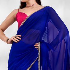 Blue & Pink colored saree is made from georgette fabric which is highlighted with beautiful sequins work as shown. Comes along with unstitched georgette blouse piece which you can customise as per your design/style. Occasion - You can wear this saree for party and functions. Note:- the actual product may differ slightly in color and design from the one illustrated in the images when compared with computer or mobile screen. Measurements: Saree : Georgette : 5.5 Mtrs Blouse : Georgette : 0.8 Mtr M Traditional Blue Pre-draped Saree For Party, Blue Traditional Pre-draped Saree For Party, Georgette Pre-draped Saree With Dupatta For Diwali, Blue Georgette Pre-draped Party Saree, Blue Georgette Party Pre-draped Saree, Party Wear Pre-draped Saree In Georgette, Traditional Georgette Pre-draped Saree For Celebration, Party Wear Pre-draped Georgette Saree, Pre-draped Georgette Saree For Celebration