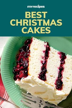 a piece of cake with white frosting and blue berries on top sits on a green plate