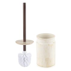 a toilet brush and holder are shown on a white background with a brown pole in the corner