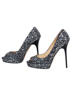 Add some serious sparkle to any look with these Jimmy Choo open-toe pumps! These glittering showstoppers are sure to catch eyes and have you feeling like a shimmering goddess. With a 5" stiletto heel and sparkly glitter fabric, you’ll be taking your style to new heights. Get ready to shine! Size 6 (IT 36) Made in Italy Open-toe Silver & black glitter fabric Minor blemish on sole trim of right shoe Platform height 1" Heel height 5" Glitter Accents Open Toe Heels For Night Out, Glitter Accented Open Toe Heels For Night Out, Glitter Accents Open Toe Heels For Party Season, Open Toe Heels With Glitter Accents For Night Out, Open Toe Glitter Heels For Party Season, Party Season Open Toe Glitter Heels, Glamorous Glitter Heels, Glamorous Closed Toe Heels With Glitter Accents, Glamorous Glitter Open Toe Heels