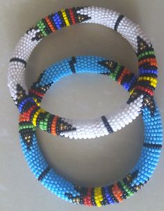 African Beaded Bracelets, Masai bracelets, African Jewelry, Zulu Bracelets, Tribal Bracelets, Moms g Turquoise Beaded Bracelets As Festival Gifts, Multicolor Beaded Wristband With Round Beads, Traditional Blue Beaded Bracelets For Festivals, Traditional White Bracelets With Polished Beads, Adjustable Beaded White Bangle, Multicolor Round Beaded Wristband, Bohemian White Bangle For Festivals, Multicolor Wristband With Large Round Beads, White Beaded Bangle With Round Beads