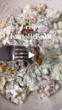 a fork in a bowl full of food with the words crispy kartoffette salad