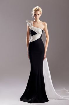 a woman in a black and white gown