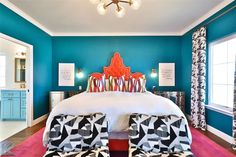 a bedroom with blue walls and pink carpet