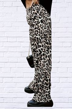 Unleash your wild side with our Full Size Animal Print Elastic Waist Pants. These pants offer a comfortable fit with an elastic waistband and a playful, eye-catching print. Perfect for adding a touch of fun to your wardrobe. Material composition: 100% Polyester Care instructions: Machine wash cold. Tumble dry low. Imported Size US Bottom Length Waist Hip S 2/4 39 25.2 0 M 6 39.4 26.8 0 L 8 39.8 28.3 0 XL 10 40.2 29.9 0 2XL 12 40.6 31.5 0 3XL 14 40.9 33.1 0 Casual Full Length Leopard Print Pants, Casual High Waist Leopard Print Pants, Trendy Printed Straight Pants, Leopard Print Loungewear Pants With Elastic Waistband, Casual Leopard Print Pants With Elastic Waistband, Trendy Relaxed Fit Leopard Print Bottoms, Casual Leopard Print Wide-leg Pants, Casual Wide-leg Leopard Print Pants, Casual Tiger Print Bottoms For Summer