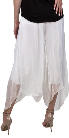 Beautiful 100% Silk Crop Balloon Pants. This is similar to the Linen Balloon Crop Pants but in a soft silk material. There is an elastic waistband. Exterior 100% Silk / Interior Lining - 95% Viscose 5% Elastin Made in Italy One Size Fits Most Model is 5'8 White Ankle-length Harem Pants, Summer Parachute Pants With Elastic Waistband And Tapered Leg, Summer Loungewear Harem Pants With Tapered Leg, Summer Loungewear Tapered Leg Harem Pants, White Harem Bottoms With Elastic Waistband, Spring Harem Pants For Loungewear, Summer Tapered Leg Harem Pants For Loungewear, Non-stretch Harem Pants With Tapered Leg And Elastic Waistband, White Rayon Bottoms For Summer