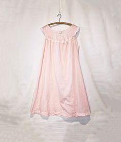 Pink Cotton Blend Nightgown Large - Loose Summer Old Fashioned Nightgown - Very sweet! Super darling and feminine pink cotton blend nightgown with lace, and embroidery on the bodice. Loose and shorter length that make it perfect for warmer months. Very soft and breathable, lightweight, and slightly transparent-- giving it an off-hand sexiness. A nice loose large. 45% cotton, 65% poly. Great vintage condition. Has seen a few gentle washes.  Size Large. Double check measurements: Bust: 52" Waist: Cheap Pink Romantic Nightgown, Pink Cotton Sleepwear For Home, Pink Cotton Sleepwear For Sleepover, Cotton Nightgown For Spring Pajama Party, Feminine Cotton Sleepwear For Sleepover, Pink Sleepwear For Spring, Feminine Pink Sleeveless Chemise, Feminine Cotton Nightgown For Pajama Party, Pink Feminine Sleepwear With Lace Trim