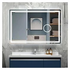 a bathroom vanity with a large mirror above it and a blue cabinet under the sink