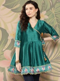 *Teal and golden printed tunic ,has a v-neck, three-quarter sleeves, tie-ups detail,   *Fabric:-  Silk Blend  *Wash Care:-  Hand Wash *Package Contains:- Only One Kurta AVAILABLE IN 7 SIZES THEY ARE IN FOLLOWING MEASUREMENTS IN INCHES:- XXS:- Bust-32/To Fit Waist-26/Length-32/Hip-34 XS:- Bust-34/To Fit Waist-28/Length-32/Hip-36 S:- Bust-36/To Fit Waist-30/Length-32/Hip-38 M:- Bust-38/To Fit Waist-32/Length-32/Hip-40 L:- Bust-40/To Fit Waist-34/Length-32/Hip-42 XL:- Bust-42/To Fit Waist-36/Length-32/Hip-44 XXL:- Bust-44/To Fit Waist-38/Length-32/Hip-46 NOTE ►► Please feel free to contact us for any further questions.CUSTOMISATION We do customisation ️ ►► Please feel free to contact us for any further questions. Traditional Green V-neck Tunic, Green V-neck Sets For Eid, Fitted V-neck Kurta For Diwali, Festive V-neck Kurta For Party, Fitted V-neck Kurta For Party, Fitted V-neck Party Kurta, Green V-neck Kurta For Eid, Eid Anarkali V-neck Dress, Spring Bollywood Style V-neck Kurta