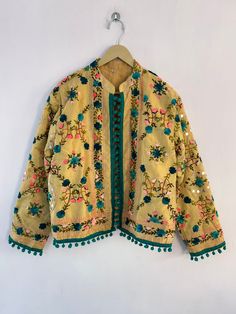 "Woman's jacket cotton Designer embroidery. This jacket was hand-made with vintage style phulkari embroidery by artisans from the nomadic desert tribe known as \"Banjara \", in the Northern India. The Jacket is no closure pattern with Long Sleeves and Vibrant Color  Size : Stitching available in all sizes you want Please Send all your measurements after placing order  Length 23 Inches Sleeve Length 23 Inches Chest - 40 Inches Shipping : Free worldwide shipping. (Note : Design of Embroidery May be change) Assorted Designs Available Condition: New Delivery Policies: . We dispatch your item within 1-3 days after order receive. . After dispatching item nothing in our hand like Exact delivery time. . You are responsible for the duties and taxes of your country. Return Policies: . Shipping charg Traditional Nehru Jacket With Dabka Work For Spring, Folk Style Outerwear With Intricate Embroidery For Spring, Bohemian Nehru Jacket With Intricate Embroidery, Festive Bohemian Nehru Jacket With Multicolor Embroidery, Folk Outerwear With Chikankari Embroidery For Fall, Folk Style Chikankari Embroidery Outerwear For Spring, Traditional Green Cotton Outerwear, Folk-style Outerwear With Chikankari Embroidery For Fall, Cotton Outerwear With Multicolor Embroidery Long Sleeve