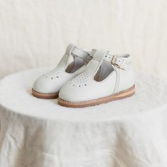 The Greta T-Strap in Fog is made of soft leather upper and lined in breathable leather which wicks away moisture. The structure of the shoe and the flexible rubber sole provide stability without weight to support your little one's early steps. We added an adorable teardrop perforation across the toe and a padded collar around the ankle. Perfect for everyday wear or special occasions. Bows by: The Little Design Co. Girl Needs, Everyday Shoes, Little Designs, T Strap, Wicks, Soft Leather, Everyday Wear, Leather Upper, Leather