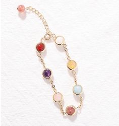 This exquisite multicolor stone bracelet is crafted from a combination of the finest materials and with the utmost care. The vibrant colors give it a luxurious and sophisticated feel, ensuring it will be a striking addition to any outfit. Perfect for adding a touch of glamour to special occasions. Multicolor Bangle For Party, Elegant Rainbow Beaded Bracelets, Elegant Rainbow Round Beads Bracelet, Elegant Pink Metal Crystal Bracelet, Elegant Rainbow Bracelets For Parties, Elegant Rainbow Bracelets With Round Beads, Adjustable Multicolor Bracelets For Party, Trendy Gold Jewelry With Natural Stones, Elegant Multicolor Metal Chain Bracelet