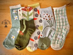 Add a playful touch to your wardrobe with this charming set of nature-inspired socks! Featuring delightful floral patterns, abstract designs, and adorable animals, each pair offers its own unique flair. These soft, comfy socks come in soothing earth tones like green, cream, and rust, perfect for adding personality to your everyday look. Sizing: One Size 50% Cotton, 45% Polyester, 5% Spandex Now, let's keep them looking and feeling fabulous with these essential washing instructions.  Trust us--yo Unique Socks, Comfy Socks, Patterns Abstract, Knitted Wit, Abstract Designs, Green Cream, Casual Socks, Adorable Animals, Socks And Hosiery