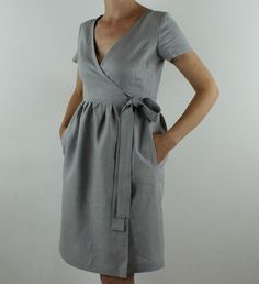 "Spring dress, Write the selected color in the message Handmade sand wrap dress with short sleeves, 2 pockets and belt , perfect for casual wear and suitable for any occasion in any season Details: - 100% natural linen produced in Europe ; - medium weight (180 gram per square meter); - color: light grey, could be any from our colors alog cat(color samples at the photo); Made to order, approximately a few days, If you have any questions please message me and I will be glad to answer. Size guide : Elegant V-neck Linen Dress With Pockets, Short Sleeve Tie Waist Wrap Dress For Day Out, Elegant Short Sleeve Linen Dress With Belt, Beige Short Sleeve Wrap Dress, Elegant Summer Linen Dress With Surplice Neckline, Gray Linen Short Sleeve Dress, Gray Short Sleeve Linen Dress, Casual Wrap Dress, Wrap Dress Casual