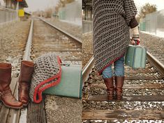 the woman is walking down the train tracks with her luggage