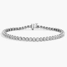 Flash some brilliance with this breathtaking tennis bracelet, showcasing dazzling round diamonds prong-set in complementing 18k white gold. Bracelet White Gold, Eternity Bracelet, Pure Elegance, Diamond Tennis Bracelet, Tennis Bracelet Diamond, Blue Nile, Brilliant Diamond, Tennis Bracelet, Prong Setting