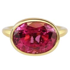 Handcrafted Oval Cut 7,35 Carats Rubelite 18 Karat Yellow Gold Cocktail Ring. Our expert craftsmen hand pierce our iconic gold lace to fit each stone on a tapered band making each ring One of a Kind. This unique technique, inspired by our designer's childhood memories of lace makers of Normandie and the intricate architecture of Indian palaces, allows natural light through its structure revealing the true natural beauty and colour of our stones. Rubelite is an exceptional and treasured gem varie Indian Palaces, Intricate Architecture, Yellow Gold Cocktail Ring, Hand Piercing, Red Tourmaline, Gold Cocktail Ring, Gold Cocktail, Luz Natural, Wide Band Rings