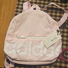 Adidas Linear Mini Backpack Clear Pink/White Brand New With Tags Pink Adidas Backpack For Daily Use, Adidas Pink Backpack For Daily Use, Pink Adidas Travel Backpack, Pink Adidas School Backpack, Back To School Adidas Backpack, White Adidas Backpack For Daily Use, White Adidas Backpack For School, Trendy Adidas Backpack For Everyday Use, Trendy Adidas Backpack