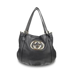 Gucci 'Britt' hobo bag in black smooth leather with with a large GG plaque in gold hardware. Features dual top buckle handles and a detachable crossbody strap. Brand = Gucci Condition = 7/10, Good. Some wear to leather body, scratching in metal hardware, wear to crossbody strap Dimensions = 16" x 13" x 0.25" top Handle = 9.5" Strap Drop = 12' Material = Leather Hardware = Soft Gold SKU = 10806-68 Gucci Satchel With Branded Hardware, Gucci Top Handle Bag With Branded Hardware, Gucci Top Handle Bag With Logo, Gucci Bag With Gold-tone Hardware And Top Handle, Gucci Top Handle Bag With Gold-tone Hardware, Gucci Tote Bag With Branded Hardware, Gucci Satchel With Detachable Strap For Shopping, Gucci Shoulder Bag With Gold-tone Hardware For Shopping, Gucci Tote Shoulder Bag With Gold-tone Hardware