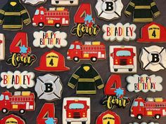 decorated cookies in the shape of fire trucks and firetrucks