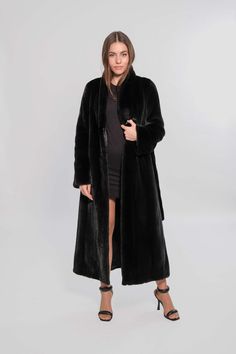 PARAMETERS *Fur category: Saga furs *Size:42 *Length: 129cm *Color: black *Fur type: Mink velvet *Collar type :standing up *Belt :Yes  DESCRIPTION  *Saga furs auction Scandinavian mink  straight coat in black collor *Saga furs are of excellent quality *Features of this model: straight silhouette  *The product is fastened with classic fur coat hooks  *The product is made according to the technology let-out *Classic fur coat pockets -side welt *The length of the product in the photo is 129 cm. *Th Formal Faux Fur Outerwear In Mink Color, Elegant Long Outerwear With Faux Fur Lining, Elegant Long Mink Outerwear, Black Long Faux Fur Coat, Mink Colored Long Sleeve Evening Outerwear, Mink-colored Faux Fur Coat For Evening, Winter Evening Faux Fur Coat, Mink-colored Faux Fur Evening Coat, Formal Black Faux Fur Coat