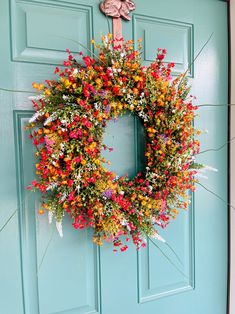 a blue door with a wreath on it