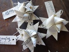 some white origami pieces with music notes on them