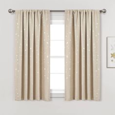 a window with curtains and stars on it