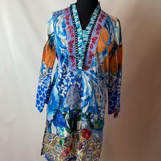 Light Weight Cotton Tunic Or Kurti Is Perfect To Wear By It Self Or As Cover-Up. Ideas Pret Cotton Lawn (Blend) Tunic With Side Slits Size Medium Shoulder To Shoulder 14” Slits 13.5” Length 36.5” Chest 20” (40”) Sleeve 23” Hips 22” (44) Blue Long Sleeve Blouse With Colorful Pattern, Blue Long Sleeve Blouse With Vibrant Print, Blue Blouse With Colorful Pattern For Vacation, Vacation Blouse With Colorful Pattern In Blue, Blue Colorful Pattern Blouse For Vacation, Blue V-neck Top With Colorful Pattern, Blue Vibrant Print Vacation Blouse, Blue V-neck Top With Vibrant Print, Vibrant Blue Long Sleeve Tops