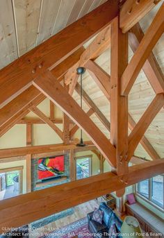 an overhead view of a living room with wood beams