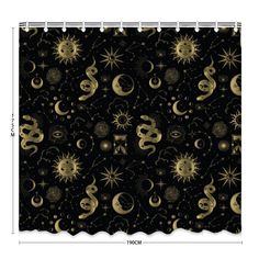 a black shower curtain with gold sun and moon designs