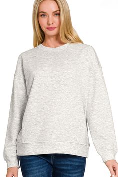 Experience ultimate comfort and style with the Zenana Scuba Round Neck Sweatshirt. Made from high-quality scuba fabric, this sweatshirt offers a soft and stretchy fit. With a classic round neck design, it is perfect for everyday wear and can be dressed up or down for any occasion. Upgrade your wardrobe with this must-have piece. Details:- Soft Scuba Fabric- Stretchy- Side Accent Seam Lines- Comfortable Loungewear Fabric Content:- 90% Polyester, 6% Rayon, 4% Spandex Heather Grey Long Sleeve Sweats In Athleisure Style, Heather Grey Long Sleeve Athleisure Sweats, Heather Grey Long Sleeve Sweats Athleisure, Sporty Long Sleeve Brushed Sweatshirt, Sporty Long Sleeve Sweatshirt With Brushed Fabric, Basic Long Sleeve Stretch Sweatshirt, Fleece Stretch Tops For Loungewear, Gray Stretch Crew Neck Sweatshirt, Gray Stretch Sweatshirt With Ribbed Cuffs